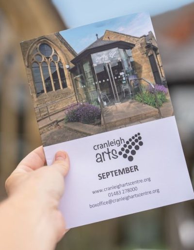 a brochure for cranleigh arts centre photographed by surrey social stock photography