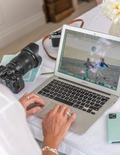 a woman works on her website during a personal brand photography shoot in guildford