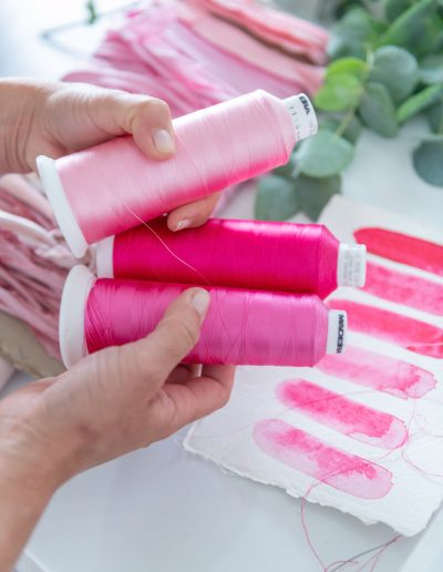 pink ribbons and paint props during a personal branding photography shoot in surrey