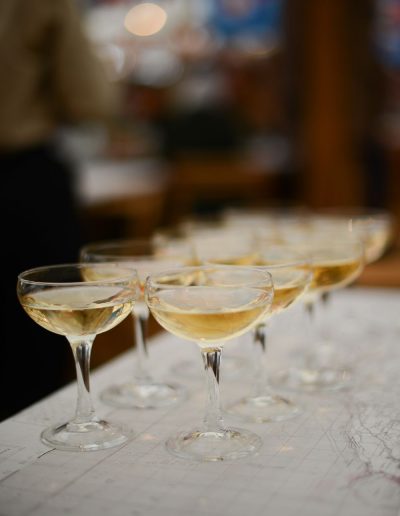 champagne glasses ready to serve during an event photographed by surrey social stock photography