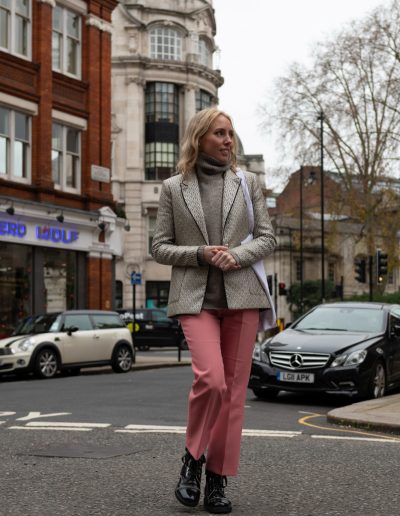 a young woman crosses a london street during a personal brand photography shoot
