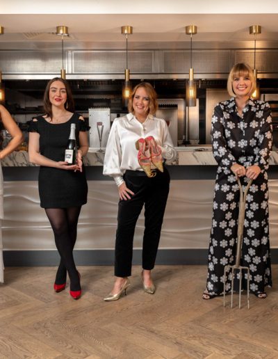a group of surrey influencers pose at a bar for a lifestyle photography shoot in guildford