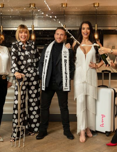 a group of surrey influencers pose at a bar for a lifestyle photography shoot in guildford