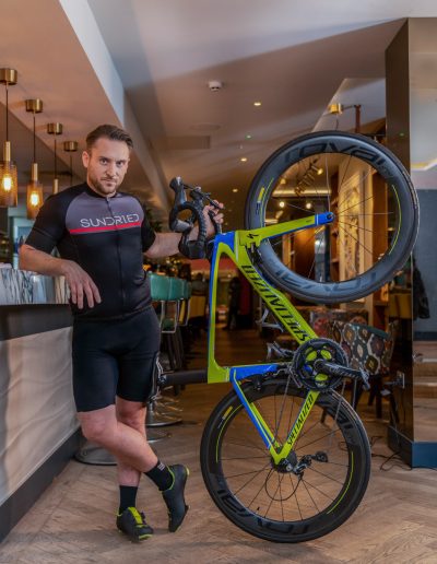 a young man poses with his road bike during a lifestyle photography shoot in guildford
