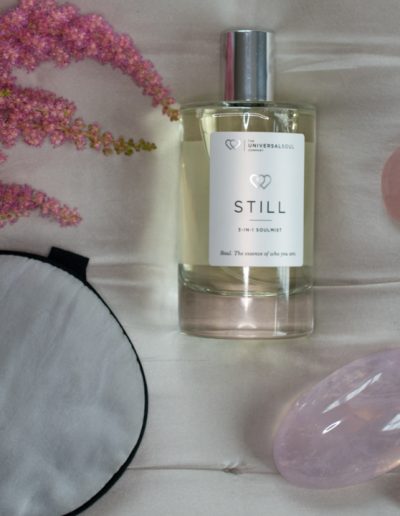 scented home spray laying on a bedspread during a product photography shoot in surrey