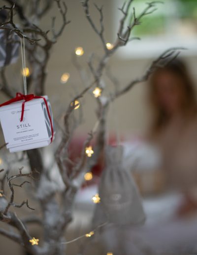 christmas gifts hanging on a tree during a product photography shoot in surrey