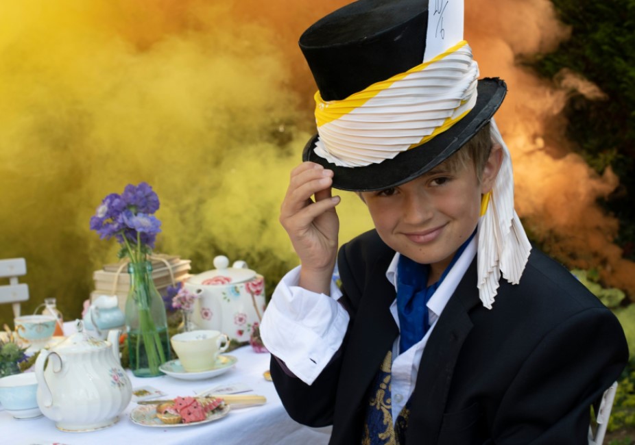 young boy dressed as the mad hatter at a vintage tea party lifestyle photoshoot in guildford