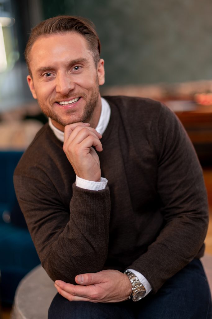 young man poses for a headshot during a headshot photography shoot in guildford