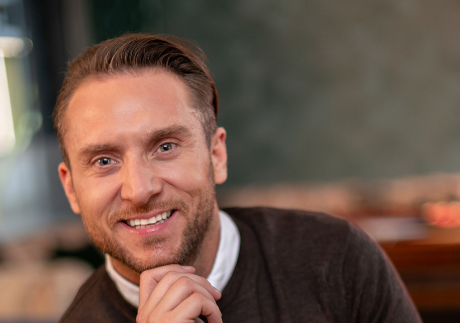 young man with beard smiling for personal brand photograph by surrey personal branding photographers surrey social stock