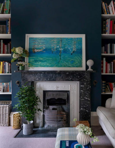 a painting above a fireplace styled for an interior photo shoot in surrey