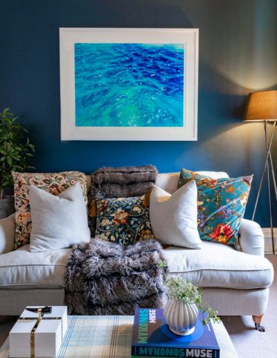 a cosy sitting room with colourful painting styled for an interior photo shoot in surrey