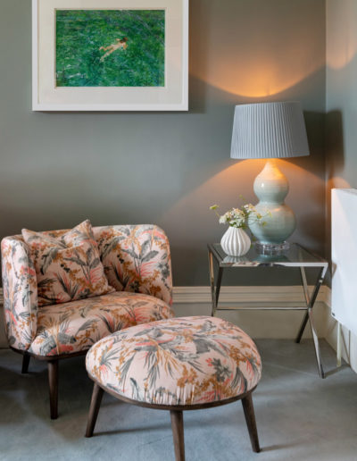 a chair and painting styled for a lifestyle photography shoot in guildford