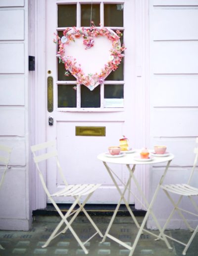 pink chairs outside peggy porschen in london