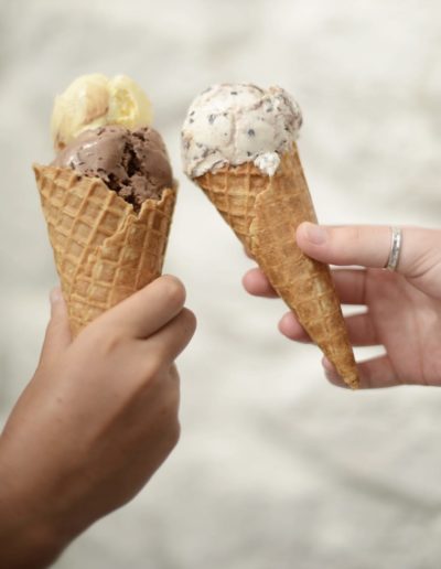 two children cheers their ice cream cones