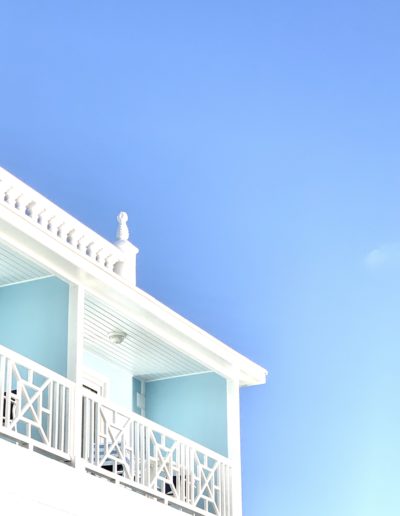 a bright white and blue apartment in nassau shot by travel photographers surrey social stock photography