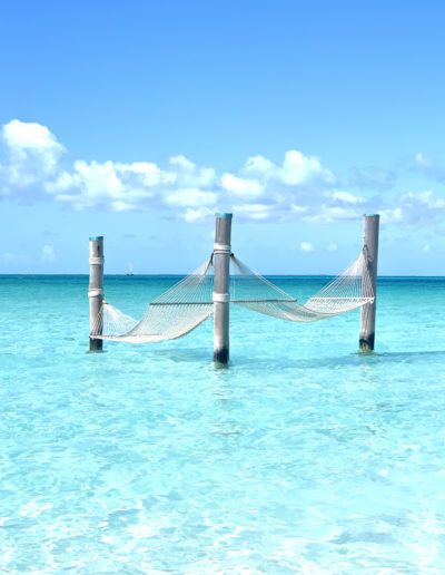 a hammock in the sea in nassau shot by travel photographers surrey social stock photography