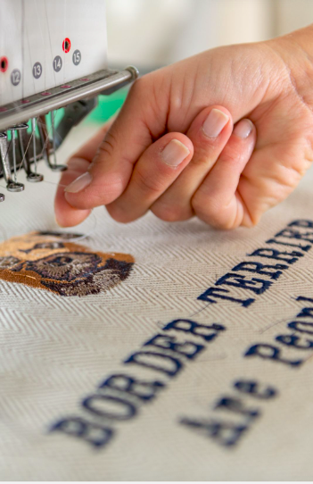 a textile designer threads her sewing machine