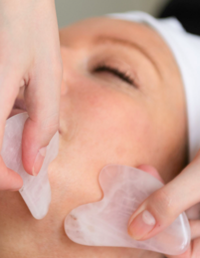 a beautician massages a client