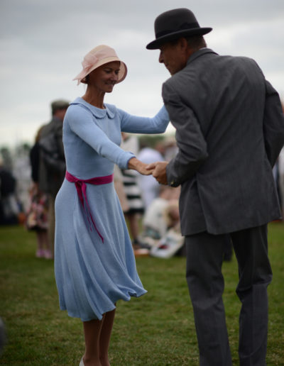 a couple dance in vintage clothes at goodwood revival