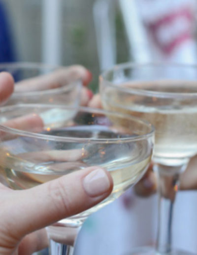 three people toast champagne