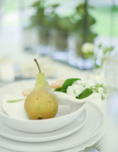 a pear in a white bowl during a lifestyle photography shoot in surrey