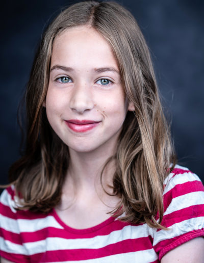 a young actor poses for a headshot photo with surrey headshot photographers surrey social stock photography