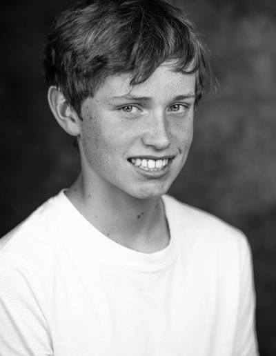 a young actor poses for a headshot photo with surrey headshot photographers surrey social stock photography