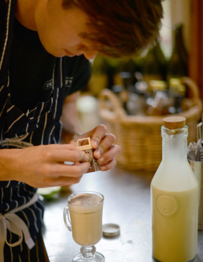 a barman creates a christmas cocktail during a hospitality photo shoot with surrey social stock photography