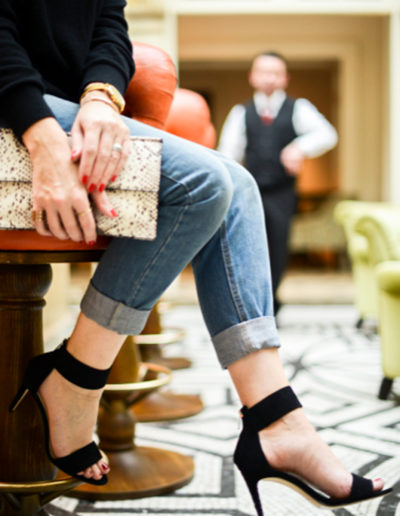 a woman sits in a cocktail bar photographed during a hospitality photo shoot by surrey social stock photography