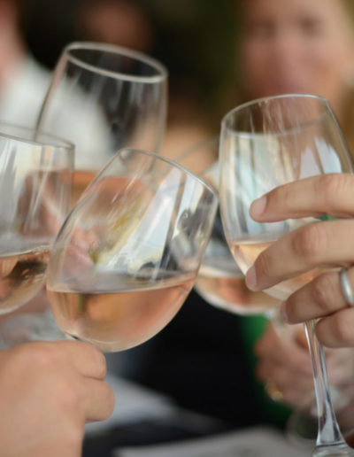 a group of friends toast each other during a business photography shoot by surrey social stock photography