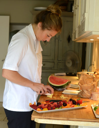 a chef prepares a meal during a hospitality photo shoot by surrey social stock photography