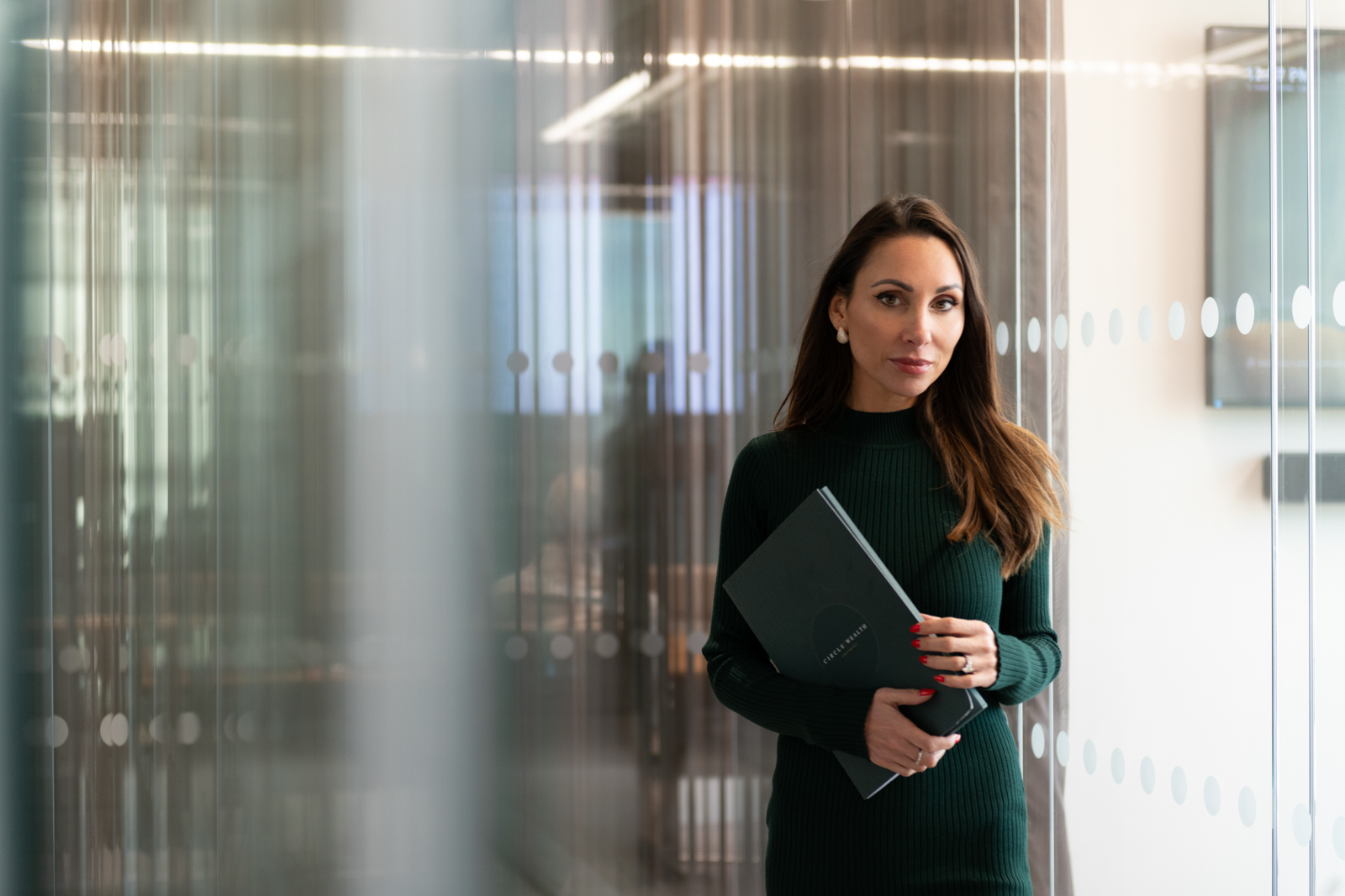 a young woman walking down a corridor during a corporate photography shoot in london