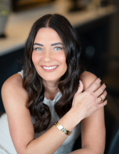 a hair dresser poses for a portrait in a salon