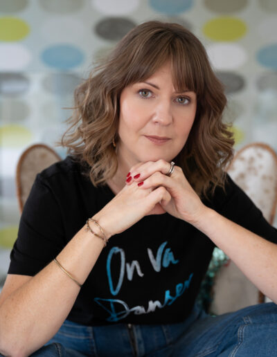 a woman poses for a photo during a personal brand photography shoot