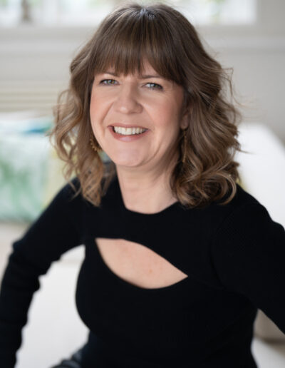 a musician smiles for the camera during a personal brand photo shoot