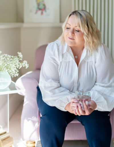 a therapist does some breath work during a personal brand photo shoot in surrey