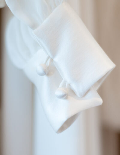 button detailing on the cuff of a wedding gown