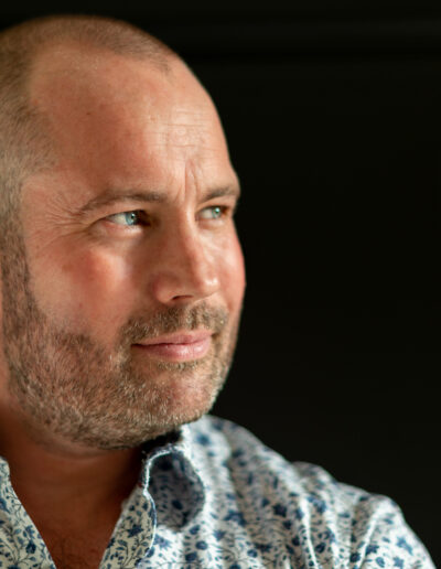 the profile of a man posing for a picture during a personal brand photo shoot in surrey