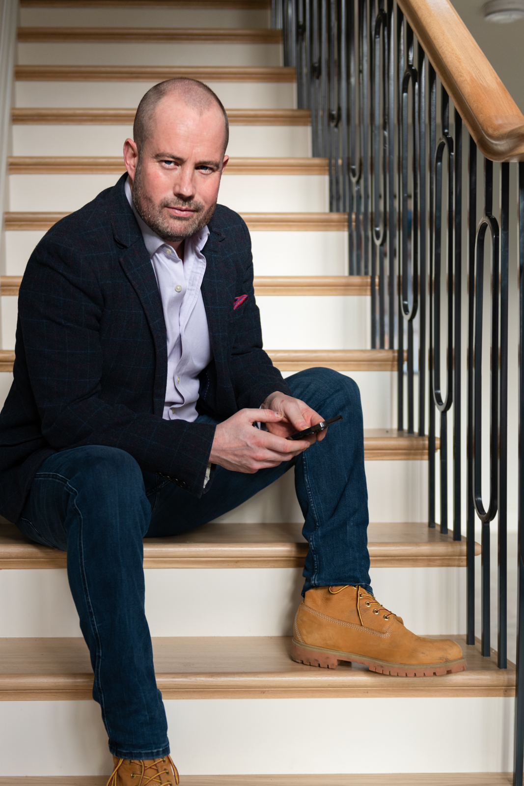 woman sitting at her kitchen table with a cup of coffee